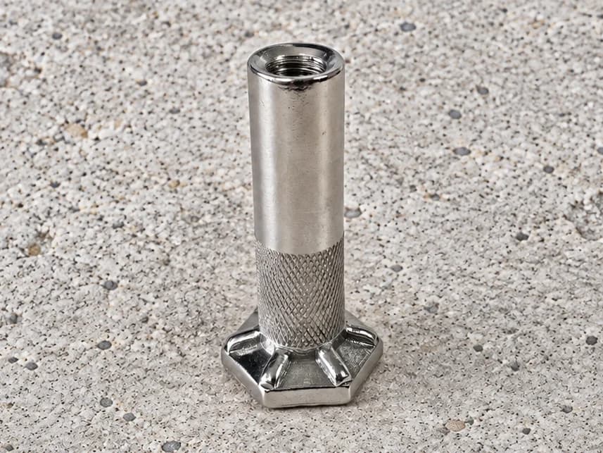 Internally threaded cylindrical ferrule with a hexagonal foot and textured lower body